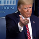 President Donald Trump speaks as Dir. of the National Institute of Allergy and Infectious Diseases Dr. Anthony Fauci looks on during a news briefing.